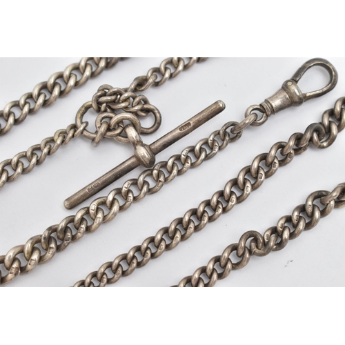 33 - TWO EARLY 20TH CENTURY SILVER ALBERT CHAINS, the first a double Albert chain, with graduating curb l... 