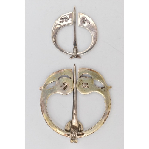 41 - TWO PENANNULAR BROOCHES, the first a silver brooch hallmarked Birmingham 1946, stamped IMC Iona, app... 