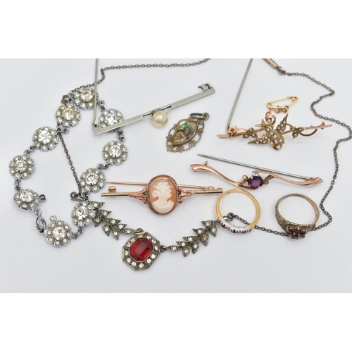 46 - A BAG OF JEWELLERY, to include a yellow metal cameo brooch, fitted with a brooch pin and safety clas... 