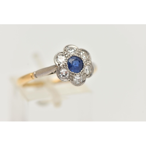 49 - A YELLOW METAL SAPPHIRE AND DIAMOND CLUSTER RING, flower cluster set with a central deep blue, circu... 