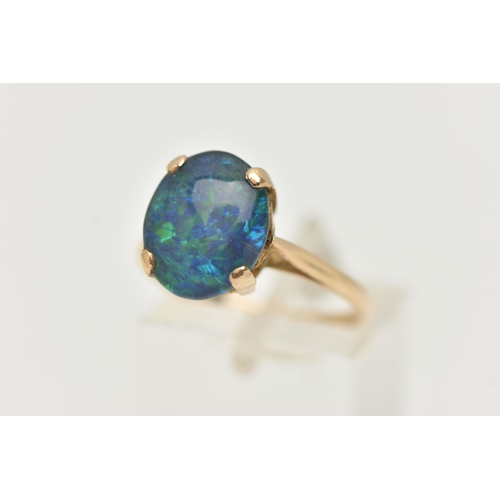 50 - A 9CT GOLD OPAL TRIPLET RING, the oval opal triplet in a four claw setting to the plain band, 9ct ha... 