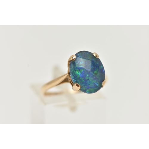 50 - A 9CT GOLD OPAL TRIPLET RING, the oval opal triplet in a four claw setting to the plain band, 9ct ha... 