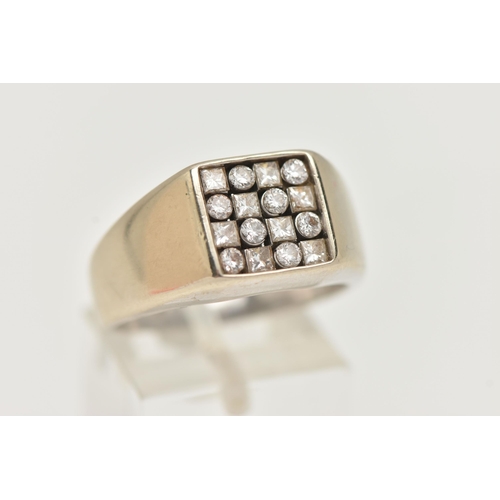 54 - A GENTLEMAN'S DIAMOND SIGNET RING, the square panel set with eight brilliant cut diamonds and eight ... 