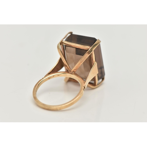 8 - A YELLOW METAL SMOKY QUARTZ DRESS RING, rectangular cut smoky quartz, measuring approximately length... 