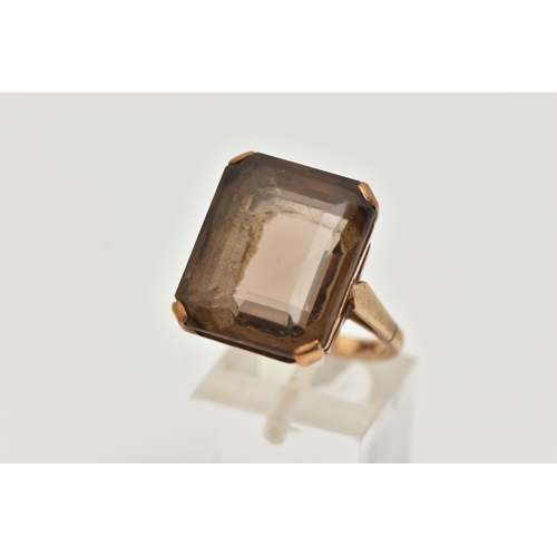 9 - A YELLOW METAL SMOKY QUARTZ DRESS RING, rectangular cut smoky quartz, measuring approximately length... 