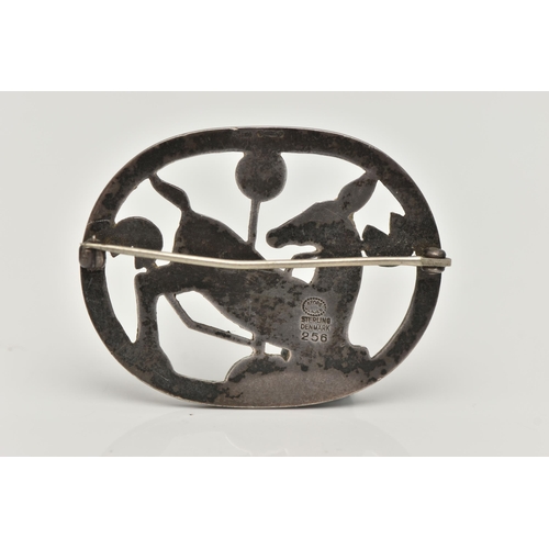 67 - A 'GEORG JENSEN' SILVER BROOCH, open work kneeling deer design in oval surround, measuring approxima... 