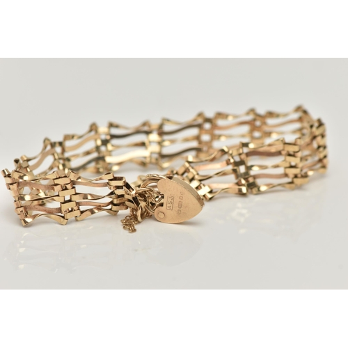 68 - A 9CT GOLD GATE BRACELET, five bar gate bracelet fitted with a heart padlock clasp, with additional ... 