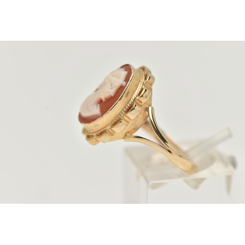 70 - A 9CT GOLD CAMEO RING, carved shell cameo, collet set within a fine rope twist and scallop surround,... 