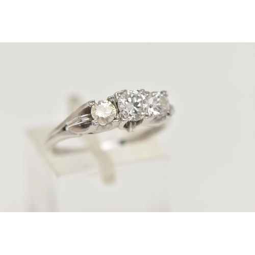 71 - A THREE STONE DIAMOND RING, a centrally set old European cut diamond with two round brilliant cut di... 