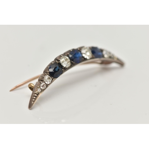 75 - A LATE VICTORIAN DIAMOND AND SAPPHIRE CRESCENT BROOCH, set with three oval cut blue sapphires, inter... 