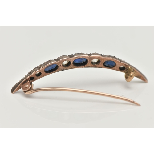 75 - A LATE VICTORIAN DIAMOND AND SAPPHIRE CRESCENT BROOCH, set with three oval cut blue sapphires, inter... 