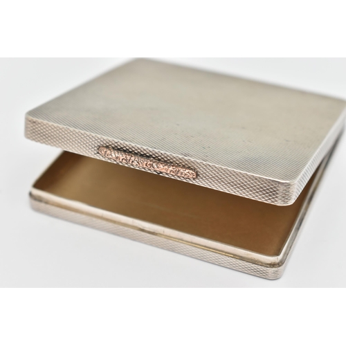 79 - A SILVER 1940S COMPACT, of a square form, engine turned pattern, gilt interior with mirror, hallmark... 