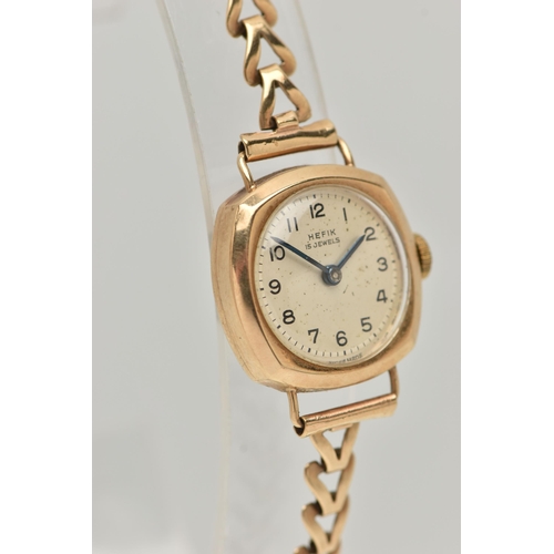 83 - A LADIES 9CT GOLD 'HEFIX 15 JEWELS' WRISTWATCH, manual wind, round silver dial signed 'Hefix', Arabi... 