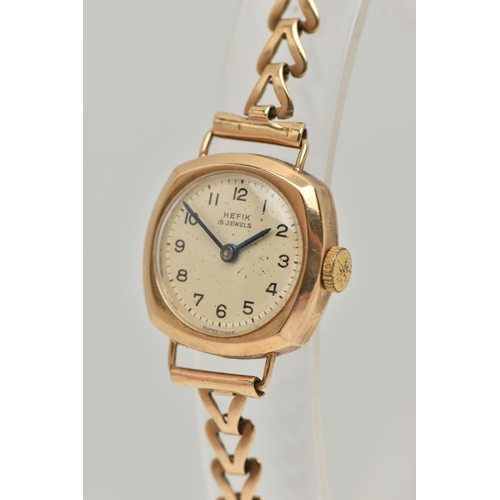 83 - A LADIES 9CT GOLD 'HEFIX 15 JEWELS' WRISTWATCH, manual wind, round silver dial signed 'Hefix', Arabi... 