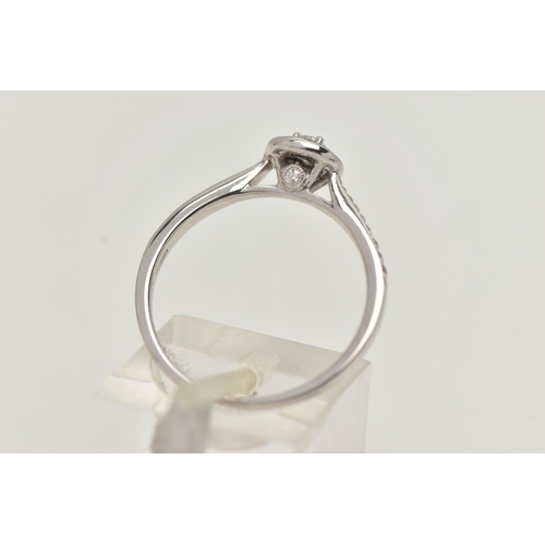 89 - A DIAMOND HALO RING, a single round brilliant cut diamond in a four prong white gold setting, grain ... 