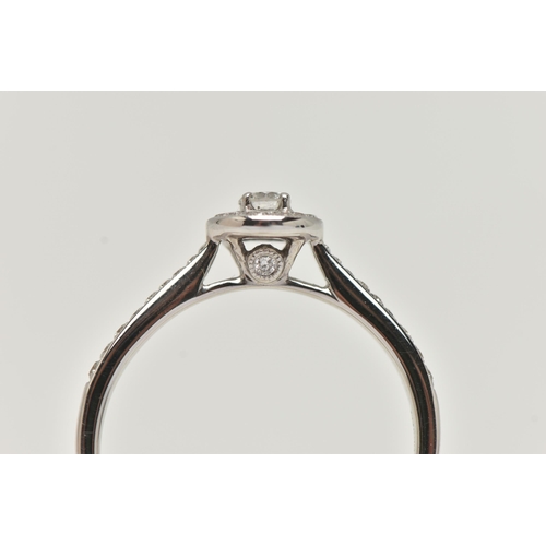 89 - A DIAMOND HALO RING, a single round brilliant cut diamond in a four prong white gold setting, grain ... 