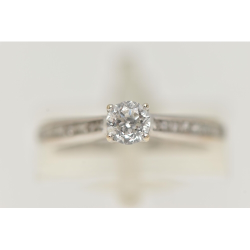 90 - A 'THE FOREVER DIAMOND' DIAMOND RING, a round brilliant cut diamond four prong set in white gold, le... 