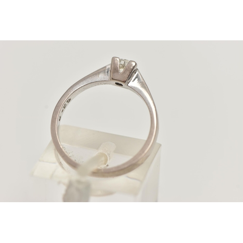 94 - A SINGLE STONE DIAMOND RING, a round brilliant cut diamond four prong set in white gold, leading on ... 