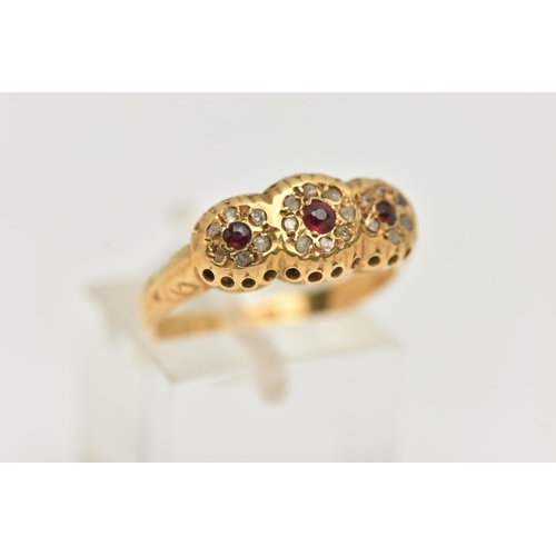 97 - A 1930'S 18CT GOLD GARNET AND DIAMOND RING, designed as three graduated circular garnets within roug... 