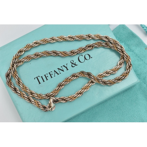 102 - A 'TIFFANY & CO' BI COLOUR ROPE TWIST NECKLACE, silver rope twist chain with a fine intertwined yell... 