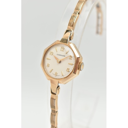 107 - A LADIES 9CT GOLD 'GARRARD' WRISTWATCH AND A NECKLACE, manual wind, round silver dial signed 'Garrar... 