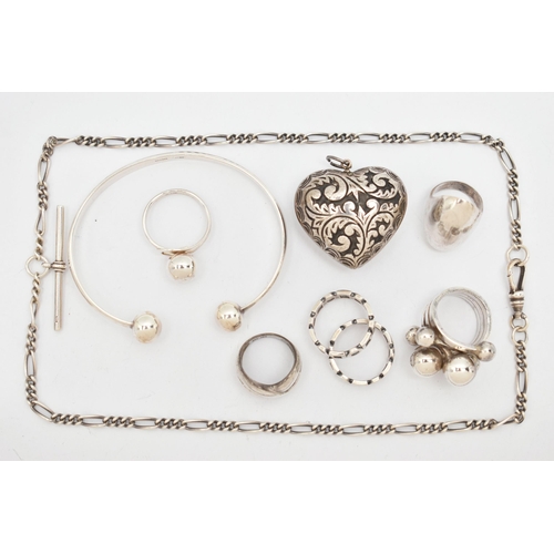 114 - A SELECTION OF SILVER AND WHITE METAL JEWELLERY, to include six rings, a heart pendant, a torque ban... 