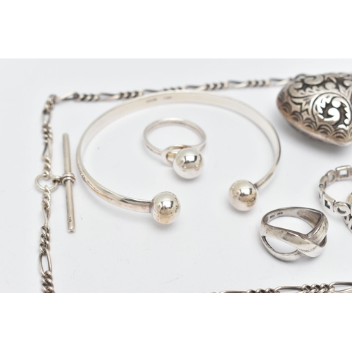 114 - A SELECTION OF SILVER AND WHITE METAL JEWELLERY, to include six rings, a heart pendant, a torque ban... 