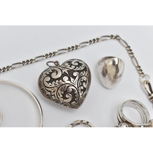 114 - A SELECTION OF SILVER AND WHITE METAL JEWELLERY, to include six rings, a heart pendant, a torque ban... 