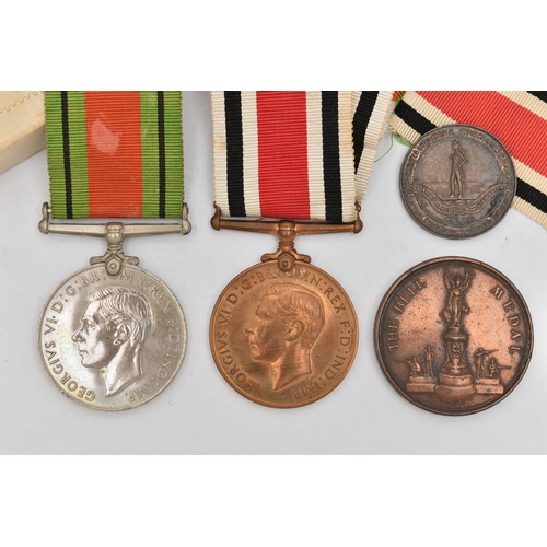 126 - A GROUP OF MEDALS, to include a 1939-1945 Defence medal, with ribbon, unassigned, a WWII Constabular... 