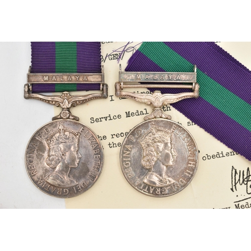 127 - TWO MALAYA MEDALS, one with box and loose ribbon, awarded to '2298817 PTE H.G.Roberts R.A.M.C', sign... 