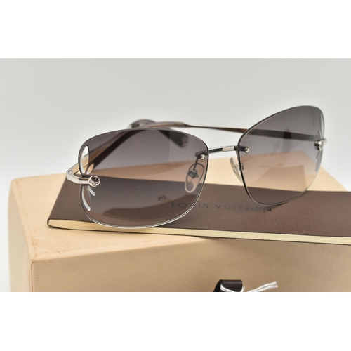 130 - A BOXED PAIR OF 'LOUIS VUITTON' RIMLESS SUNGLASSES, laser cut pattern to the edge of the graduated t... 