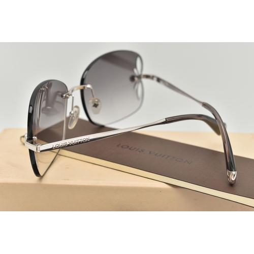 130 - A BOXED PAIR OF 'LOUIS VUITTON' RIMLESS SUNGLASSES, laser cut pattern to the edge of the graduated t... 