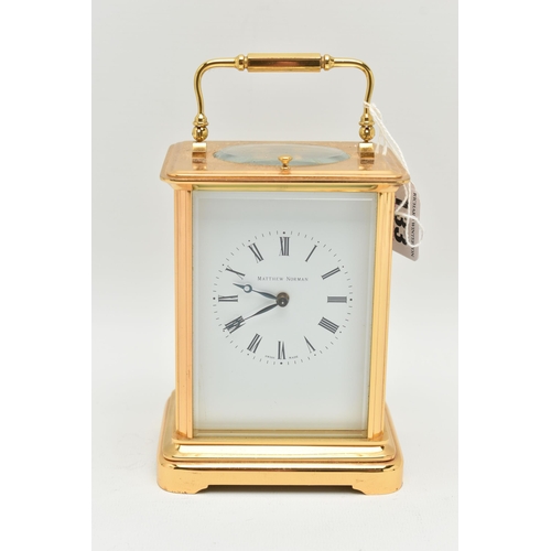 133 - A BRASS 'MATTHEW NORMAN' CARRIAGE CLOCK, with repeat mechanism, white enamel dial,  black Roman nume... 