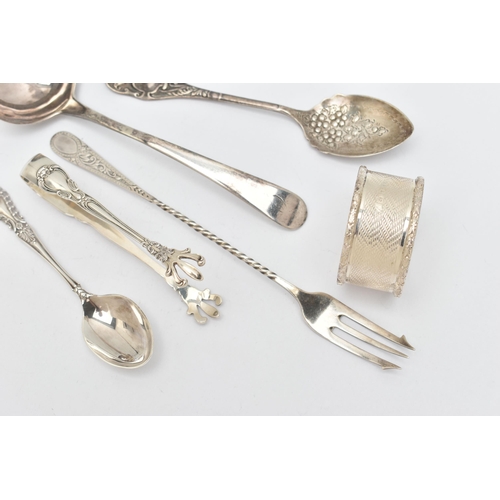 136 - A SELECTION OF SILVERWARE, to include a silver ladle, hallmark rubbed, a 1950's silver napkin ring, ... 