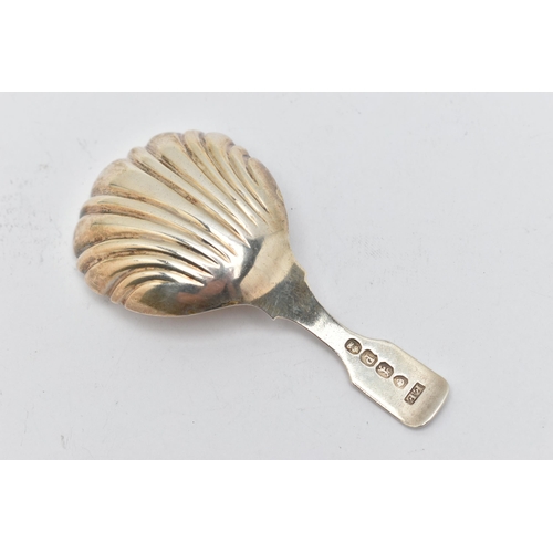 144 - AN EARLY 19TH CENTURY SILVER CADDY SPOON, with shell design gilt bowl, with leopard head engraved to... 