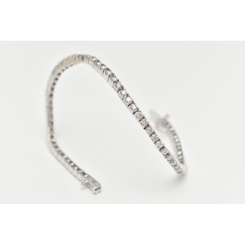 150 - A 9CT WHITE GOLD DIAMOND LINE BRACELET, designed as sixty-four round brilliant cut diamonds each wit... 