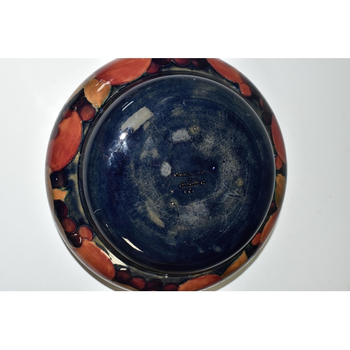 306 - A MOORCROFT POTTERY POMEGRANATE BOWL, decorated with pomegranates on a mottled blue ground, impresse... 