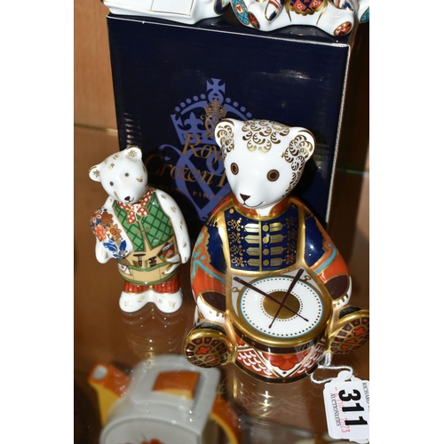 311 - A BOXED ROYAL CROWN DERBY 'DRUMMER BEAR' PAPERWEIGHT AND THREE MINIATURE TEDDIES FIGURES, comprising... 