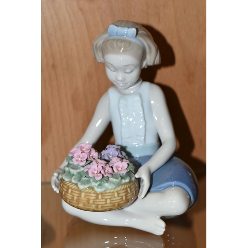 336 - THREE LLADRO AND NAO FIGURES, comprising Lladro 'Arranging Flowers' model no 8574, sculptor Raul Rub... 