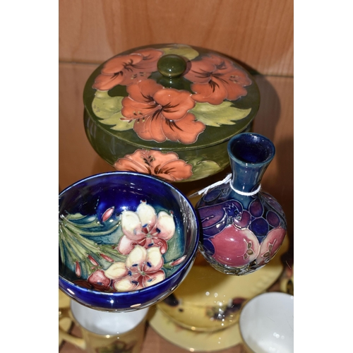 338 - THREE PIECES OF MOORCROFT POTTERY, comprising a Finch and Berries pattern bud vase, height 10cm, a F... 