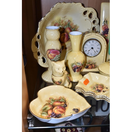 345 - A LARGE QUANTITY OF AYNSLEY ORCHARD GOLD PATTERN GIFTWARE, comprising an arched mantel clock, height... 