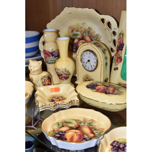 345 - A LARGE QUANTITY OF AYNSLEY ORCHARD GOLD PATTERN GIFTWARE, comprising an arched mantel clock, height... 