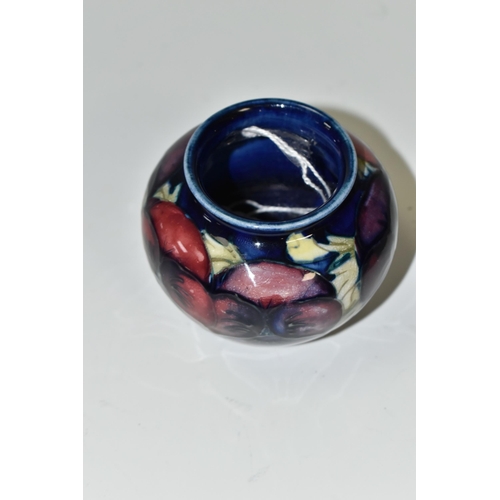 348 - A MOORCROFT POTTERY 'BLUE PANSY' PATTERN SMALL BULBOUS VASE, purple and blue pansies on a dark blue ... 