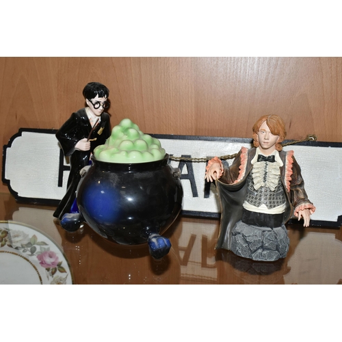 349 - A HARRY POTTER COOKIE JAR,  Harry Potter standing next to a large bubbling cauldron, wand in hand, m... 