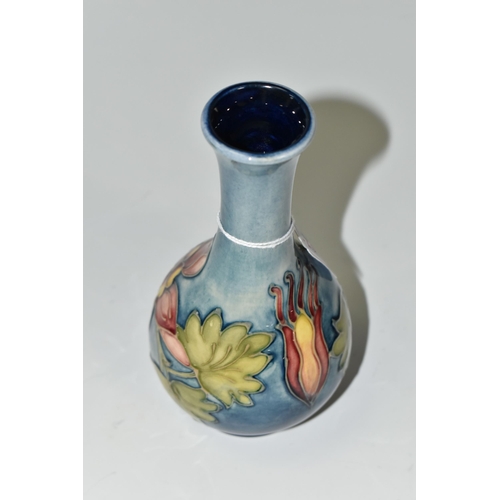 351 - A MOORCROFT POTTERY 'COLUMBINE' PATTERN BUD VASE, yellow and pink flowers on a blue ground, impresse... 