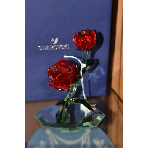 369 - A BOXED SWAROVSKI 'RED ROSE' 5424466, on a mirrored stand, part of the Swarovski Crystal Paradise Co... 