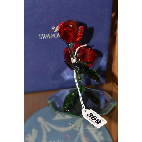 369 - A BOXED SWAROVSKI 'RED ROSE' 5424466, on a mirrored stand, part of the Swarovski Crystal Paradise Co... 