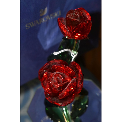 369 - A BOXED SWAROVSKI 'RED ROSE' 5424466, on a mirrored stand, part of the Swarovski Crystal Paradise Co... 