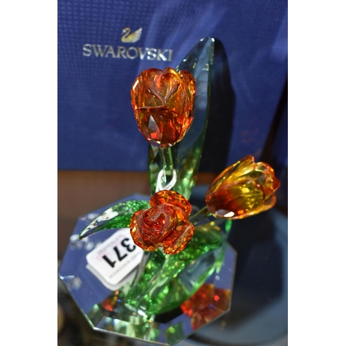 371 - A BOXED SWAROVSKI PARADISE FLOWERS 'TULIPS' 5302530, with a mirrored stand, designed by Juan Ignacio... 