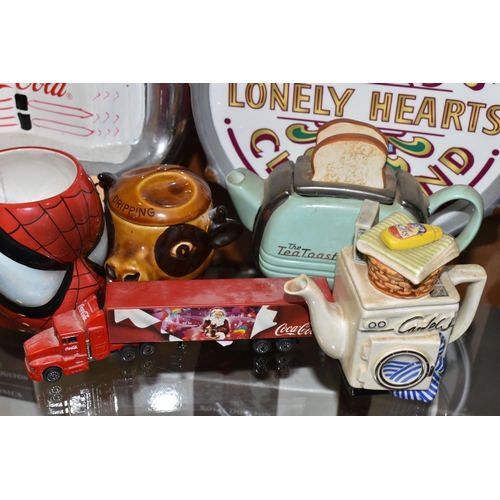 383 - A COLLECTION OF CERAMIC COOKIE JARS AND NOVELTY TEAPOTS, comprising an official Beatles Merchandise ... 